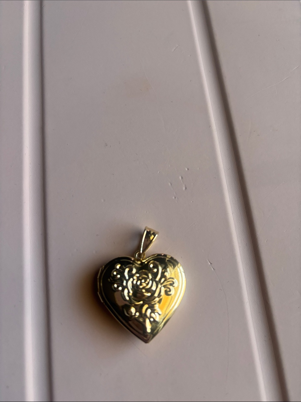 Gold Heart Locket Pendant with Floral Engraving laminated Gold.